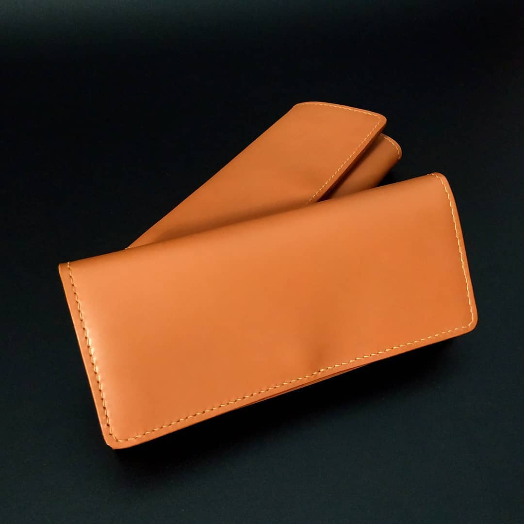 Long women's purse in Camel Tan shade.